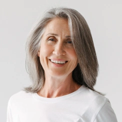 Older woman smiling with dentures