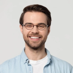 man with glasses smiling